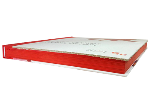 White hardcover book with red fore-fore-fore-edge painting